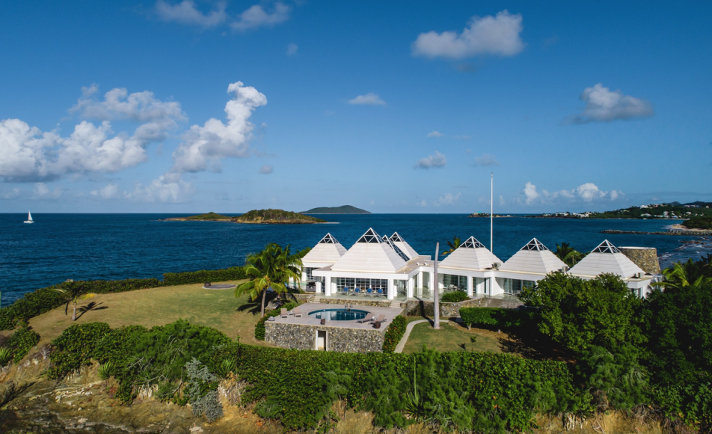 At Pyramid Point, a private beachfront compound on St. Croix, vast walls of glass invite ocean views and sea breezes into the minimalist interiors. The property has direct access to Shoys Beach, one of the finest beaches in the Caribbean.